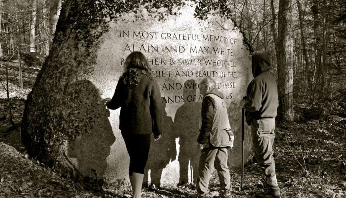 memorial rock with people